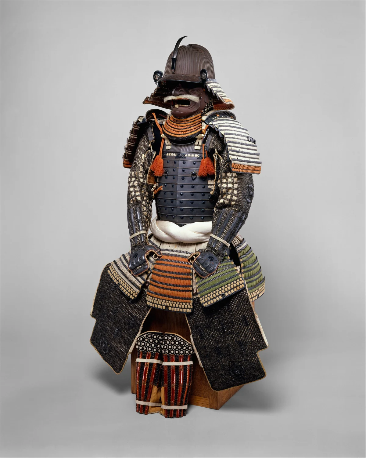 A full suit of armour with helmet and grimacing face mask