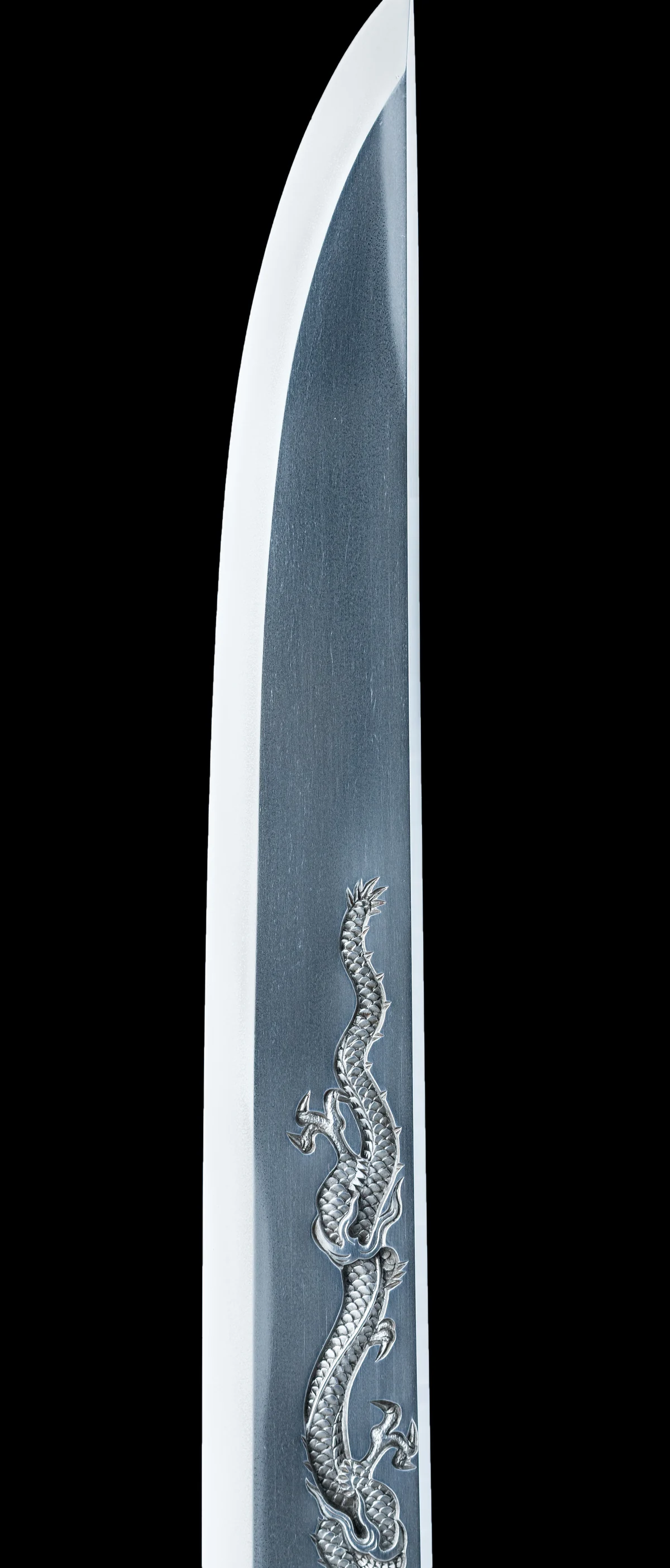A dagger blade carved with a dragon
